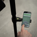 Closeup of hand using Emlid Flow on a survey pole