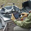 Inspection professional or utilities engineer configuring  DJI Dock 2 via a DJI RC Plus Controller for remote operations