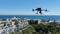 Santa Monica Police Department's DJI Matrice 300 hovering over the city in a Drone as First Responder (DFR) Use Case