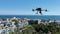 Santa Monica Police Department's DJI Matrice 300 hovering over the city in a Drone as First Responder (DFR) Use Case