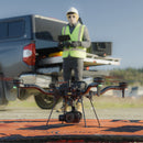 A drone pilot is piloting the Freefly Astro Max in the field