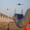 A surveyor flying a Matrice 4 drone while using a DJI D RTK 3 Multifunctional Station for corrections