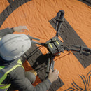 An engineer sets up the Freefly Astro in the field