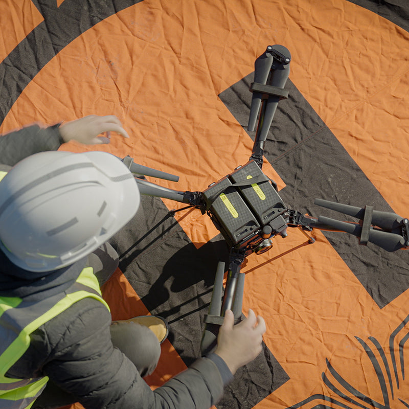 An engineer sets up the Freefly Astro in the field