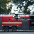 DJI Matrice 4T Drone flying in front of a fire truck