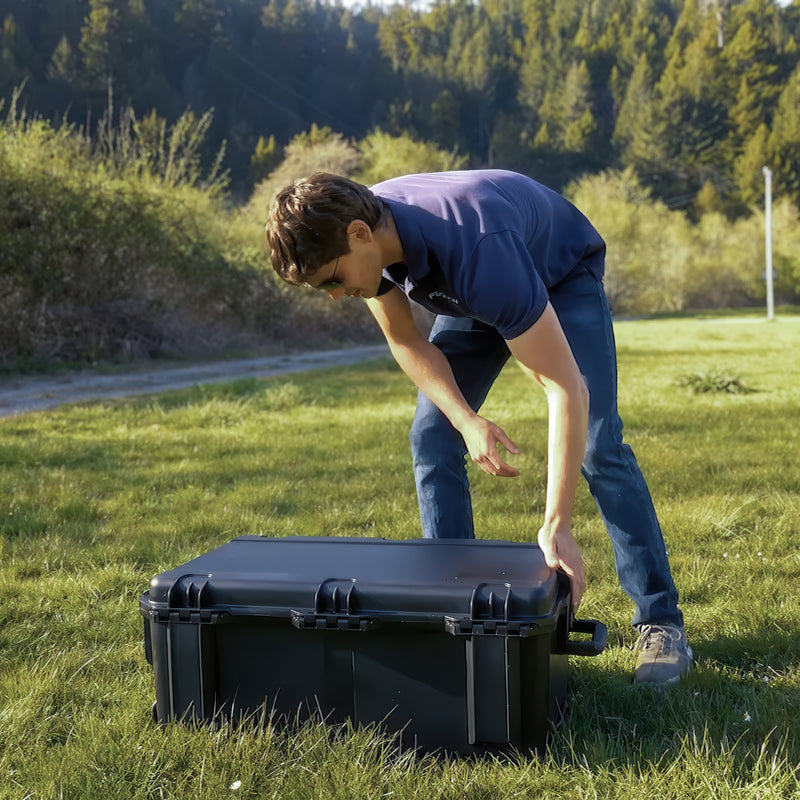 Flightwave employee opening hard case for Edge 130 VTOL