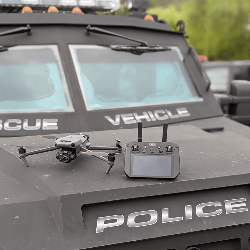 DJI Mavic 3T (thermal drone) and RC controller on top of a police command vehicle